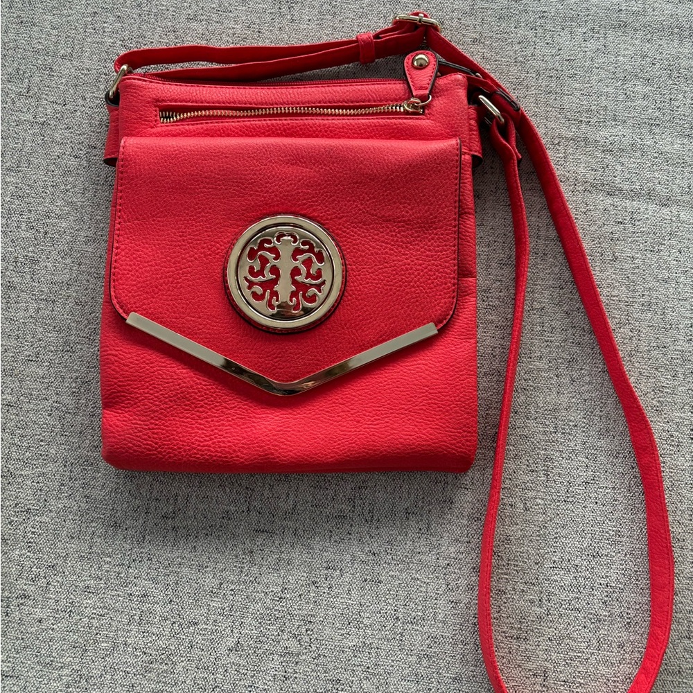 Vibrant Red Crossbody Bag with Smooth Material and Long Strap